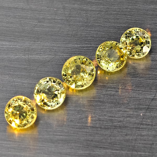 Natural Greenish Yellow Titanium Sphene Gemstones Rainbow Spark 1.46 Ct. 5 Pcs Round Shape 3.8 Mm.: Product ID: 806509339 Product Name: Natural Sphene Weight: 1.46 CT. Size: 3.8 x 3.8 x 2.6 MM. Shape: Round Shape Color: Greenish Yellow Titanium Ranibow Spark Clarity:SI1 Luster: Good Gems Origin: Mad