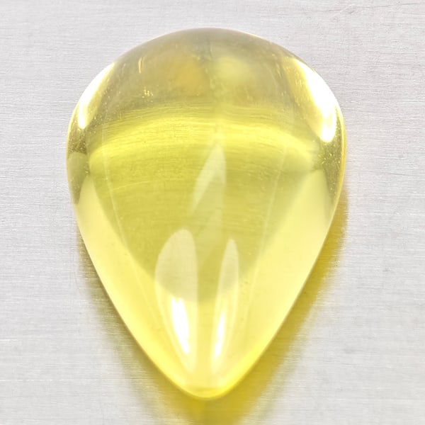 Natural Yellow Lemon Quartz Gemstones 10.88 Ct. Pear Cabochon Shape 18.4 x 12 Mm.: Product ID: 805530057 Product Name: Natural Quartz Weight: 10.88 CT. Size: 18.4 x 12 x 8.8 MM. Shape: Pear Cabochon Color: Yellow Clarity:None Luster: Good Gems Origin: Brazil Treatment: Unheated Crys