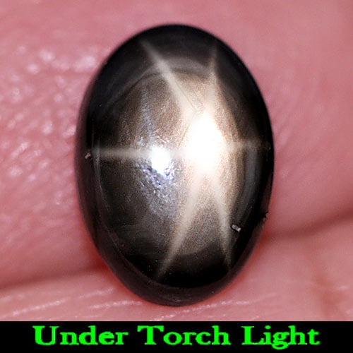 Natural Black Star Sapphire Gemstones 2.66 Ct. Oval Cabochon 9.6 x 6.8 Mm.: Product ID: 806155076 Product Name: Natural Star Sapphire Weight: 2.66 CT. Size: 9.6 x 6.8 x 3.5 MM. Shape: Oval Cabochon Color: Black Clarity:Opaque Luster: Good 6 Rays Star Gems Origin: Thailand Tre