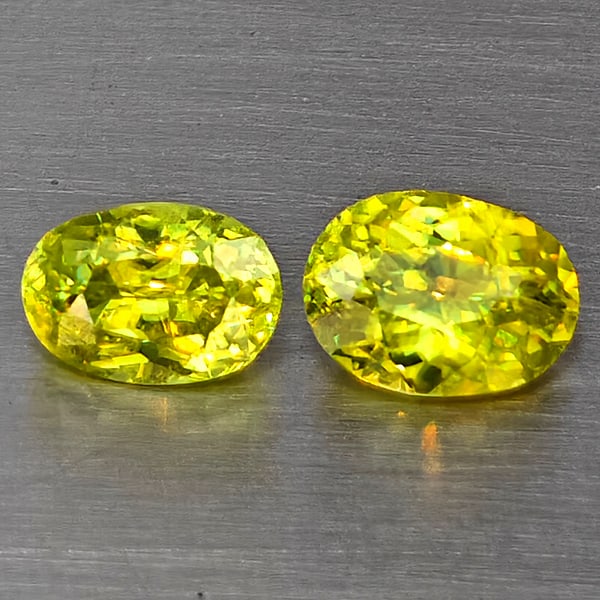 Natural Multi-Color With Rainbow Spark Sphene Gemstones 0.71 Ct. 2 Pcs Oval Shape 5.5 x 4 Mm.: Product ID: 806509274 Product Name: Natural Sphene Weight: 0.71 CT. Size: 5.5 x 4 x 2.5 MM. Shape: Oval Color: Multi-Color Clarity:SI1 Luster: Good Gems Origin: Madagascar Treatment: Unheated Crystal 