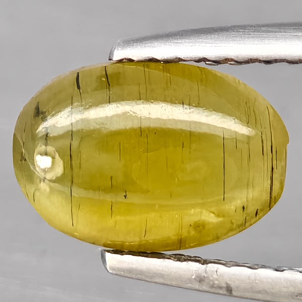 Natural Yellowish Green Cats Eye Apatite Gemstones 2.21 Ct. Oval Cabochon Shape 9.4 x 6.5 Mm.: Product ID: 800613810 Product Name: Natural Apatite Weight: 2.21 CT. Size: 9.4 x 6.5 x 4 MM. Shape: Oval Cabochon Color: Yellowish Green Clarity:Semi - Transparent Luster: Good Gems Origin: Tanzania T