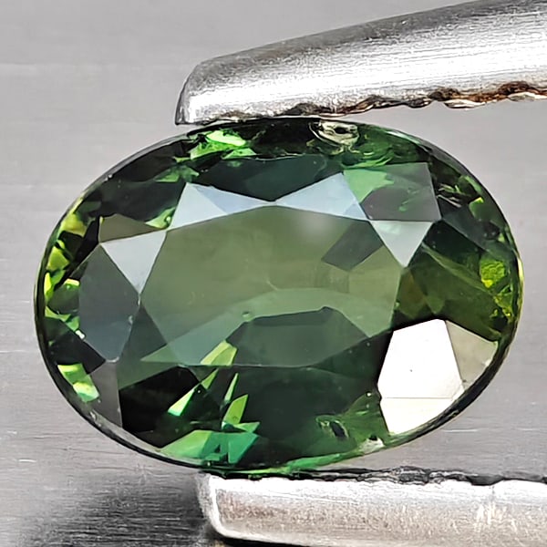 Natural Green Sapphire Gemstones 0.64 Ct. Oval Shape 6 x 4.4 Mm.: Product ID: 806162987 Product Name: Natural Green Sapphire Weight: 0.64 CT. Size: 6 x 4.4 x 2.8 MM. Shape: Oval Shape Color: Green Clarity:SI1 Luster: Good Gems Origin: Thailand Treatment: Heated Crys