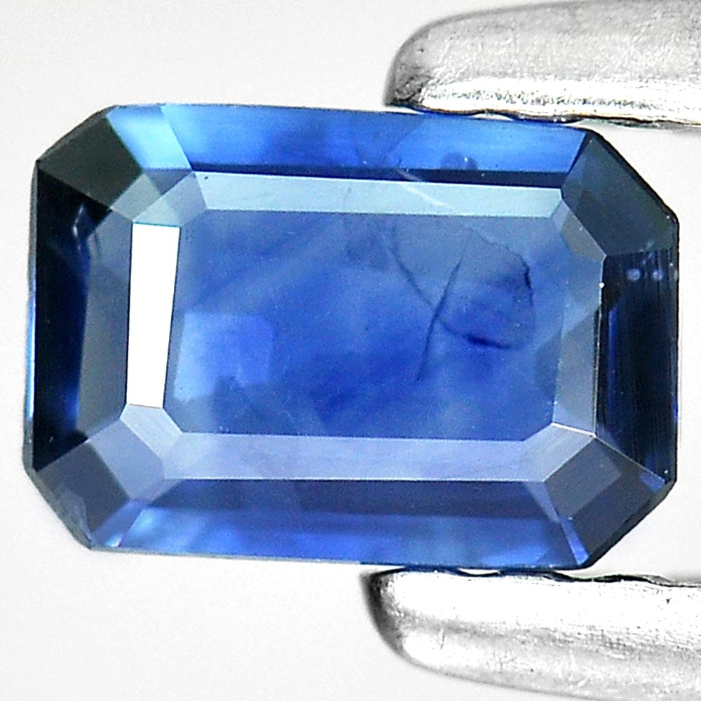 Natural Blue Sapphire Gemstone 0.37 Ct. Octagon Shape 5.4 x 3.7 Mm.: Product ID: 806006823 Product Name: Natural Blue Sapphire Weight: 0.37 CT. Size: 5.4 x 3.7 x 1.6 MM. Shape: Octagon Color: Blue Clarity:VSI Luster: Good Gems Origin: Thailand Treatment: Heated Crystal