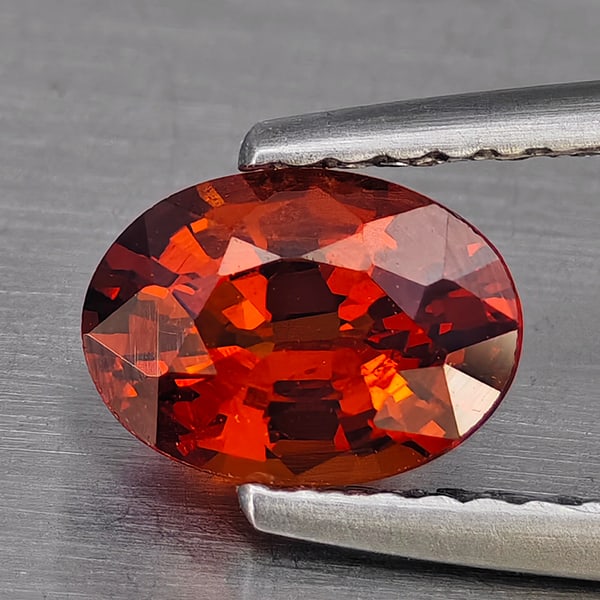 Natural Reddish Orange Spessartine Garnet Gemstones 1.11 Ct. Oval Shape 7.3 x 5.2 Mm.: Product ID: 802936318 Product Name: Natural Spessartine Weight: 1.11 CT. Size: 7.3 x 5.2 x 3.5 MM. Shape: Oval Color: Orange Clarity:VSI Luster: Good Gems Origin: Nigeria Treatment: Unheated Crystal S