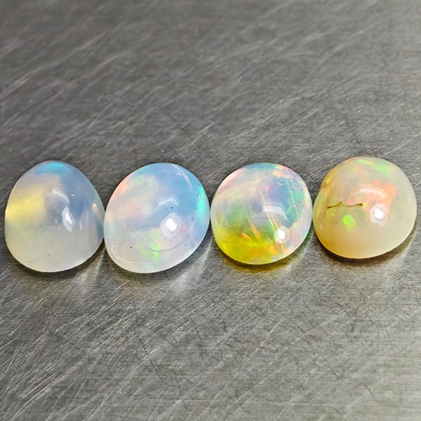 Natural Multi-Color Play Of Colour Opal 3.13 Ct. 4 Pcs. Oval Cab 8.1 x 6.1 Mm.: Product ID: 818728046 Product Name: Natural Opal Weight: 3.13 CT. Size: 8.1 x 6.1 x 2.3 MM. Shape: Oval Cabochon Color: Multi-Color Clarity:Semi - Transparent Luster: Good Gems Origin: Ethiopia Treatm
