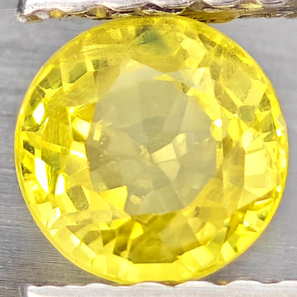 Natural Yellow Sapphire Gemstones 0.69 Ct. Round Shape 4.8 Mm.: Product ID: 806162939 Product Name: Natural Yellow Sapphire Weight: 0.69 CT. Size: 4.8 x 4.8 x 3.2 MM. Shape: Round Shape Color: Yellow Clarity:VSI Luster: Good Gems Origin: Thailand Treatment: Heated