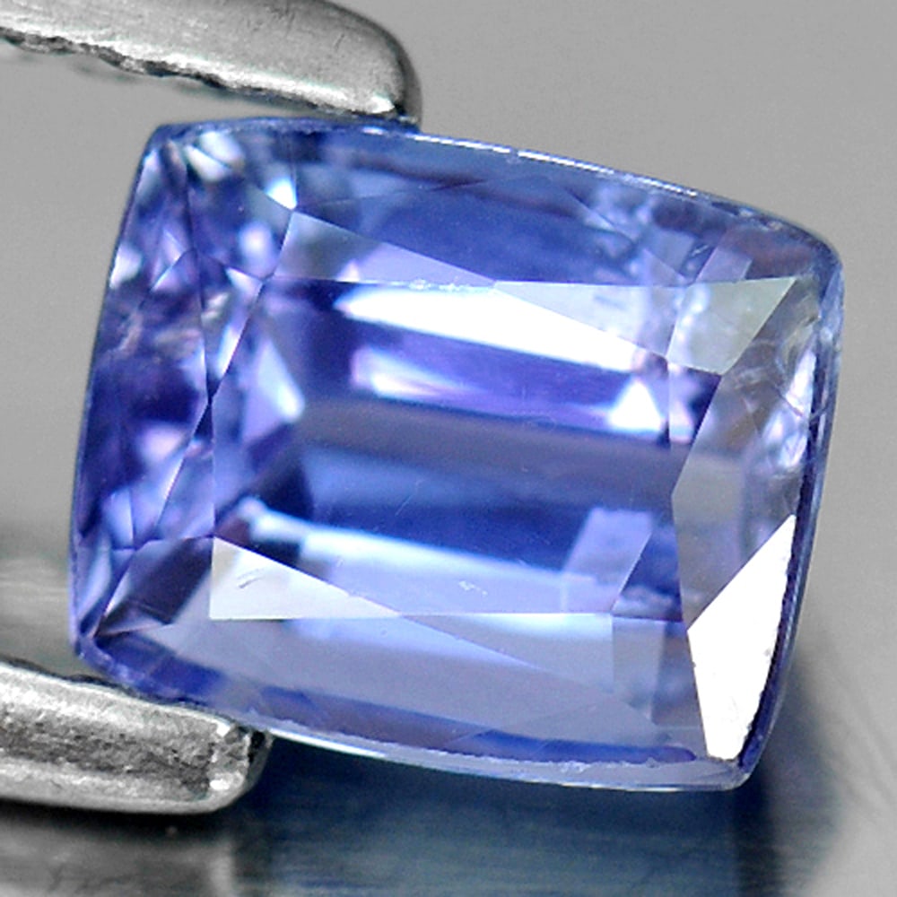 Natural Blue Tanzanite Gemstone 1.03 Ct. Cushion Shape 6 x 5 Mm.: Product ID: 807009205 Product Name: Natural Tanzanite Weight: 1.03 CT. Size: 6 x 5 x 3.5 MM. Shape: Cushion Color: Violetish Blue Clarity:SI Luster: Good Gems Origin: Tanzania Treatment: Heated Crysta