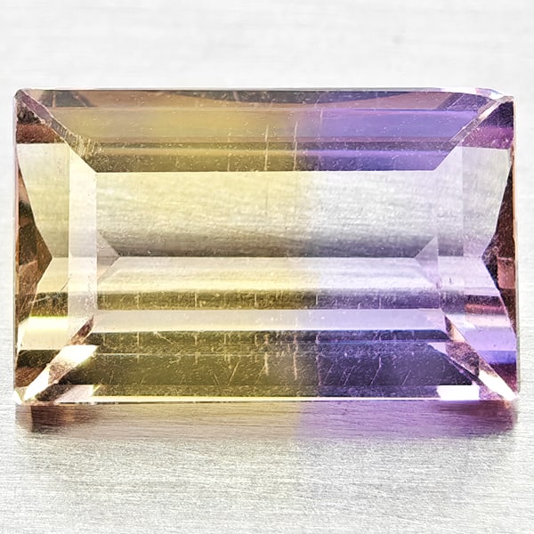 Natural Bi Color Ametrine Gemstones 2.96 Ct. Baguette Shape 11 x 6.9 Mm.: Product ID: 800408484 Product Name: Natural Ametrine Weight: 2.96 CT. Size: 11 x 6.9 x 4.8 MM. Shape: Baguette Color: Bi Color Clarity:VSI Luster: Good Gems Origin: Bolivia Treatment: Unheated Crystal