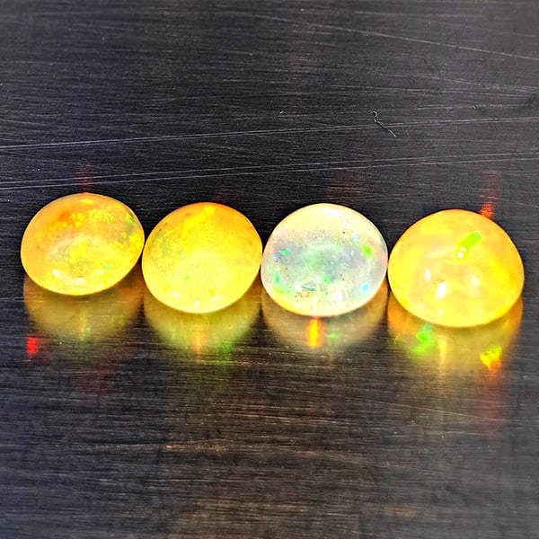 Natural Multi Color Opal Gemstones 1.85 Ct. 4 Pcs Oval Cabochon Shape 6.2 x 5.5 Mm.: Product ID: 818728399 Product Name: Natural Opal Weight: 1.85 CT. Size: 6.2 x 5.5 x 3.5 MM. Shape: Oval Cabochon Color: Multi-Color Clarity:Semi - Transparent Luster: Good Gems Origin: Ethiopia Treatm