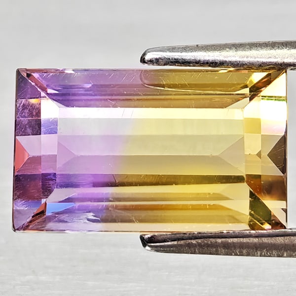 Natural Bi Color Ametrine Gemstones 2.94 Ct. Octagon Shape 10.4 x 6.3 Mm.: Product ID: 800408307 Product Name: Natural Ametrine Weight: 2.94 CT. Size: 10.4 x 6.3 x 5.6 MM. Shape: Octagon Color: Bi Color Clarity:VSI - SI1 Luster: Good Gems Origin: Bolivia Treatment: Unheated 