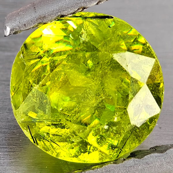 Natural Multi-Color With Rainbow Spark Sphene Gemstones 1.06 Ct. Round Shape 6 Mm.: Product ID: 806509225 Product Name: Natural Sphene Weight: 1.06 CT. Size: 6 x 6 x 4.3 MM. Shape: Round Shape Color: Multi-Color Clarity:SI1 Luster: Good Gems Origin: Madagascar Treatment: Unheated Cry