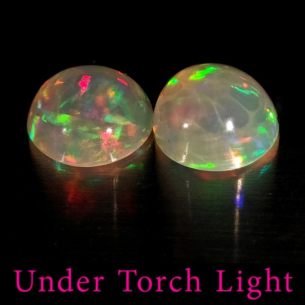 Natural Multi Color Opal Gemstones 1.46 Ct. 2 Pcs Round Cabochon Shape 6.9 Mm.: Product ID: 818728179 Product Name: Natural Opal Weight: 1.46 CT. Size: 6.9 x 6.9 x 3.8 MM. Shape: Round Cabochon Color: Multi-Color Clarity:Semi - Transparent Luster: Good Gems Origin: Ethiopia Treat
