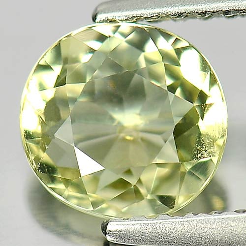 Natural Light Greenish Yellow Tourmaline Gemstones 1.09 Ct. Clean Oval Shape 6.9 x 6.5 Mm.: Product ID: 807246286 Product Name: Natural Tourmaline Weight: 1.09 CT. Size: 6.9 x 6.5 x 3.6 MM. Shape: Oval Color: Light Greenish Yellow Clarity:VSI Luster: Good Gems Origin: Nigeria Treatment: Unhe