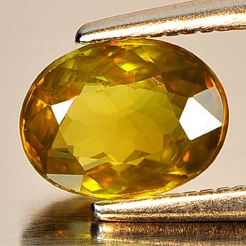 Natural Greenish Yellow Titanium Sphene Gemstones Rainbow Spark 1.17 Ct. Oval Natural 7.4 x 5.6 Mm. (1 of 3)