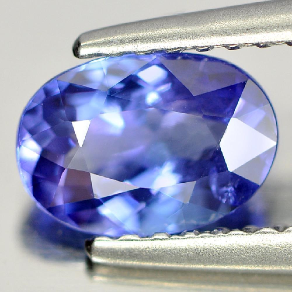Natural Blue Tanzanite Gemstone 0.98 Ct. Oval Shape 7.4 x 5.2 Mm.: Product ID: 807005389 Product Name: Natural Tanzanite Weight: 0.98 CT. Size: 7.4 x 5.2 x 3.5 MM. Shape: Oval Color: Blue Clarity:SI Luster: Good Gems Origin: Tanzania Treatment: Heated Crystal Structu