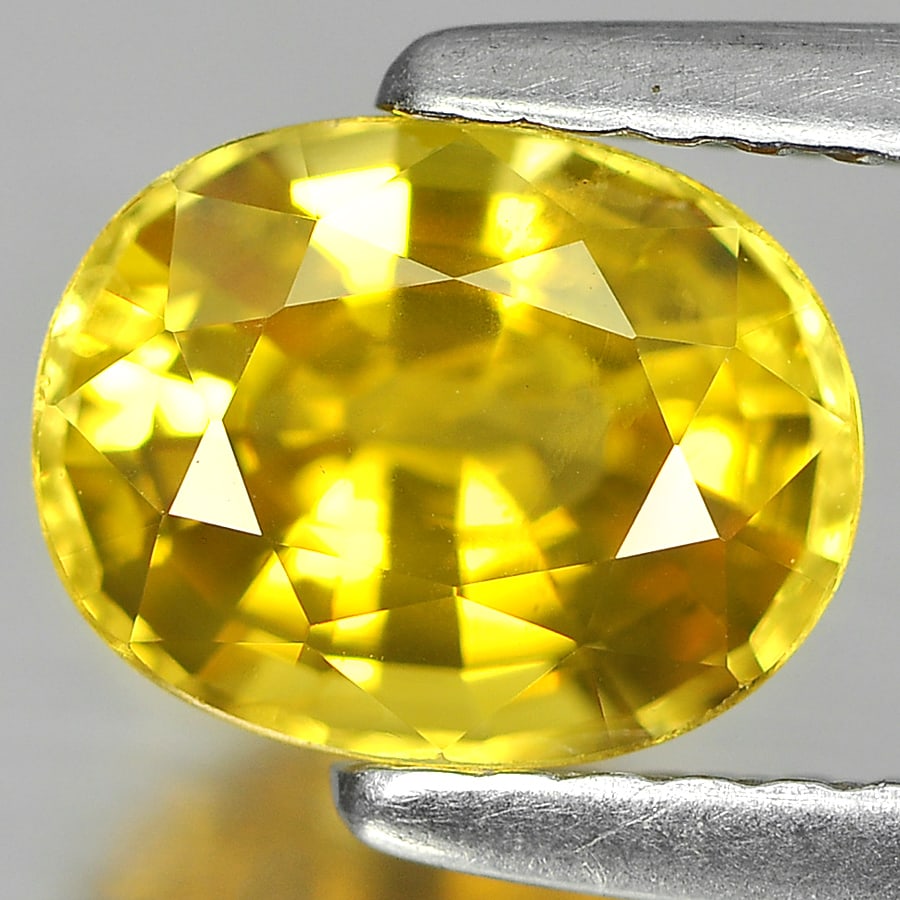 Natural Yellow Sapphire Gemstones 1.68 Ct. Clean Oval Shape 7.6 x 6 Mm.: Product ID: 806151528 Product Name: Natural Yellow Sapphire Weight: 1.68 CT. Size: 7.6 x 6 x 4.3 MM. Shape: Oval Color: Yellow Clarity:VSI Luster: Good Gems Origin: Thailand Treatment: Heated Crystal 