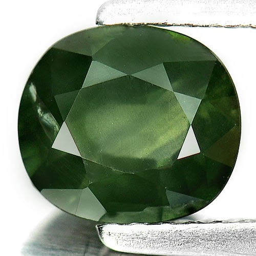 Natural Green Sapphire Gemstones 1.46 Ct. Oval Shape 7.2 x 6.4 Mm.: Product ID: 806154530 Product Name: Natural Green Sapphire Weight: 1.46 CT. Size: 7.2 x 6.4 x 3.6 MM. Shape: Oval Color: Green Clarity:VSI Luster: Good Gems Origin: Thailand Treatment: Heated Crystal 