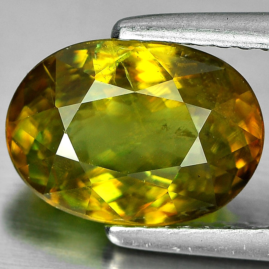 Natural Yellowish Green Sphene Gemstones 2.82 Ct. Oval Shape 10 x 7.3 Mm. (1 of 3)