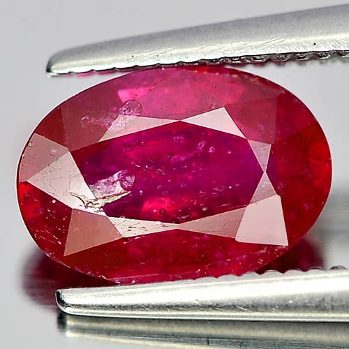 Natural Purplish Red Ruby Gemstones 1.68 Ct. Oval Shape 8.6 x 6 Mm.: Product ID: 805920716 Product Name: Natural Ruby Weight: 1.68 CT. Size: 8.6 x 6 x 3.4 MM. Shape: Oval Color: Purplish Red Clarity:VSI Luster: Good Gems Origin: Mozambique Treatment: Heated (Lead-glass