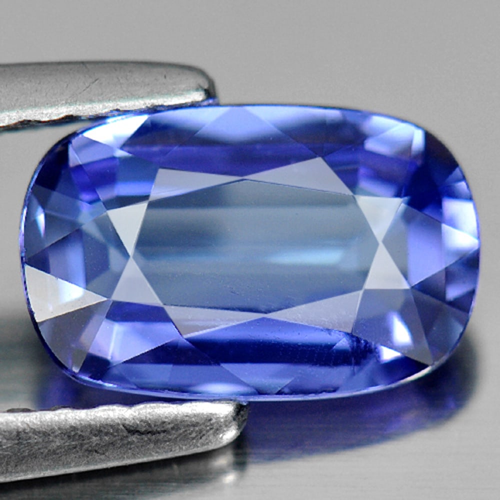 Natural Blue Tanzanite Gemstones 1.30 Ct. Clean Cushion Shape 8 x 5 Mm.: Product ID: 807006562 Product Name: Natural Tanzanite Weight: 1.30 CT. Size: 8 x 5 x 2.3 MM. Shape: Cushion Color: Violetish Blue Clarity:IF Luster: Good Gems Origin: Tanzania Treatment: Heated Crysta
