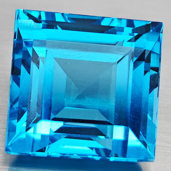 Natural Swiss Blue Topaz Gemstones 49.23 Ct. Square Shape 20 x 20 Mm.: Product ID: 807168690 Product Name: Natural Blue Topaz Weight: 49.23 CT. Size: 20 x 20 x 13.3 MM. Shape: Square Color: Swiss Blue Clarity:VVS Luster: Good Gems Origin: Brazil Treatment: Treated Crysta