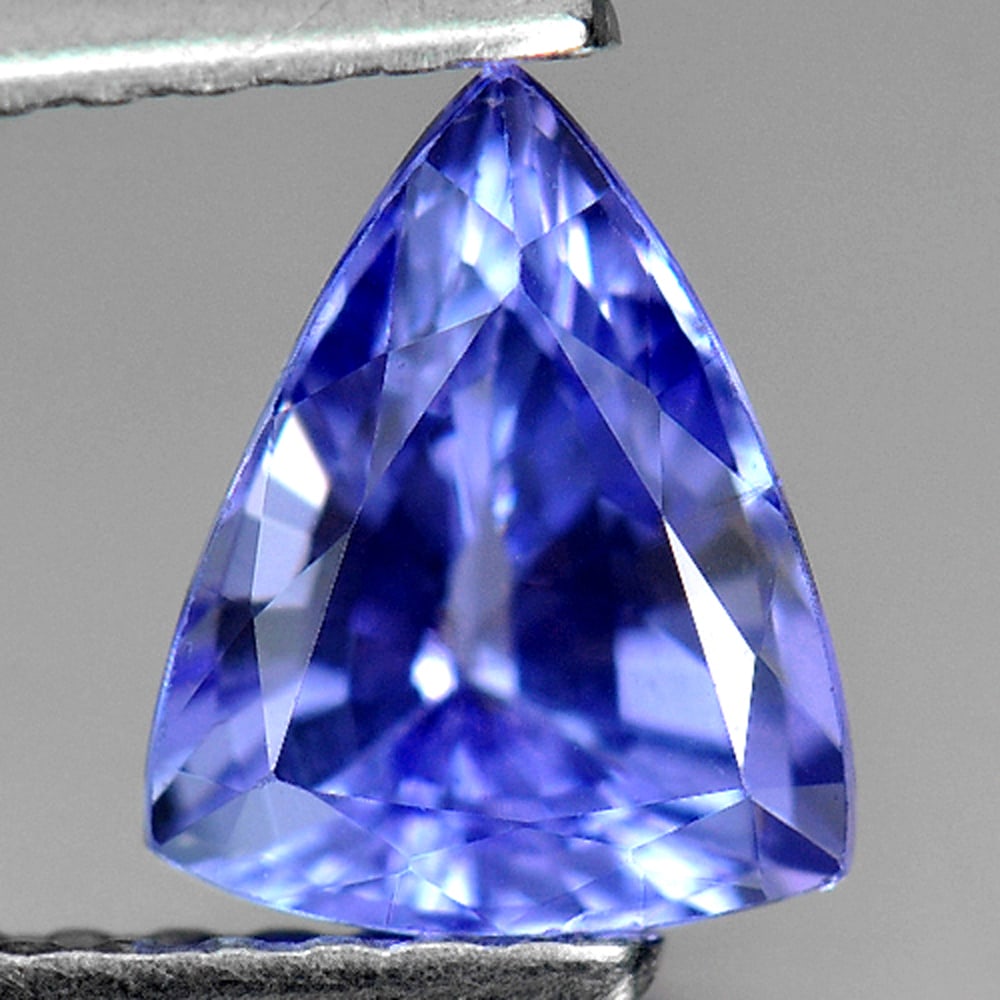 Natural Blue Tanzanite Gemstone 1.12 Ct. Trilliant Shape 7.1 x 5.7 Mm.: Product ID: 807009132 Product Name: Natural Tanzanite Weight: 1.12 CT. Size: 7.1 x 5.7 x 4.1 MM. Shape: Trilliant Color: Violet Blue Clarity:VSI Luster: Good Gems Origin: Tanzania Treatment: Heated Cr