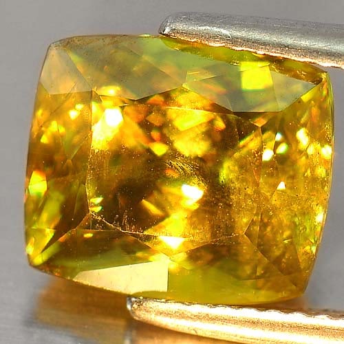 Natural Intense Green Sphene With Rainbow Spark 5.16 Ct. Cushion Shape 10.4 x 8.9 Mm.: Product ID: 806504164 Product Name: Natural Sphene Weight: 5.16 CT. Size: 10.4 x 8.9 x 6.8 MM. Shape: Cushion Color: Intense Green With Rainbow Clarity:SI Luster: Adamantine Gems Origin: Madagascar, A