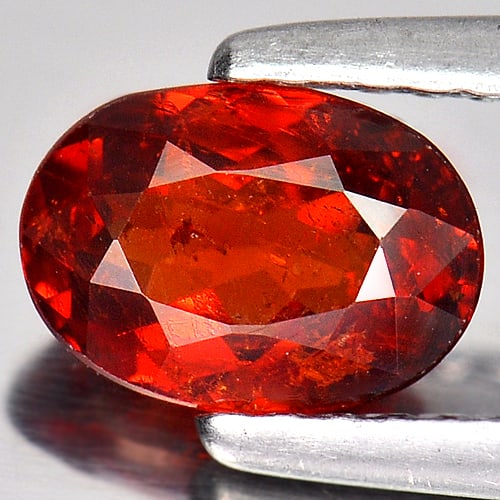 atural Reddish Orange Spessartine Garnet Gemstones 1.22 Ct. Oval Shape 7.2 x 5.2 Mm.: Product ID: 802918105 Product Name: Natural Spessartine Weight: 1.22 CT. Size: 7.2 x 5.2 x 3.3 MM. Shape: Oval Color: Reddish Orange Clarity:SI Luster: Good Gems Origin: Nigeria Treatment: Unheated Cr