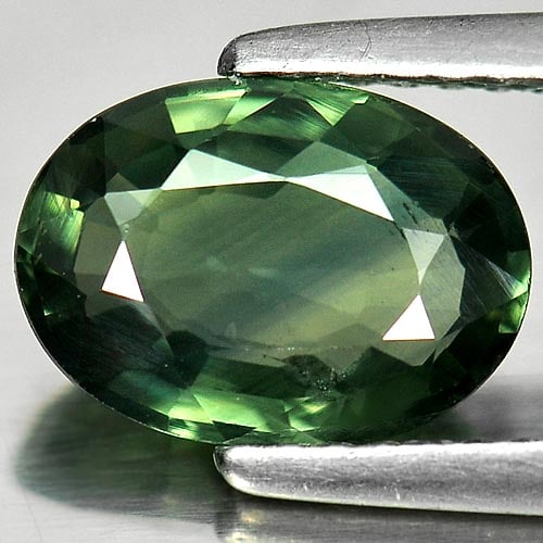 Natural Green Sapphire Gemstones 2.27 Ct. Oval Shape 9.4 x 6.8 Mm.: Product ID: 806143009 Product Name: Natural Green Sapphire Weight: 2.27 CT. Size: 9.4 x 6.8 x 3.6 MM. Shape: Oval Color: Green Clarity:VSI Luster: Good Gems Origin: Thailand Treatment: Heated Crystal 