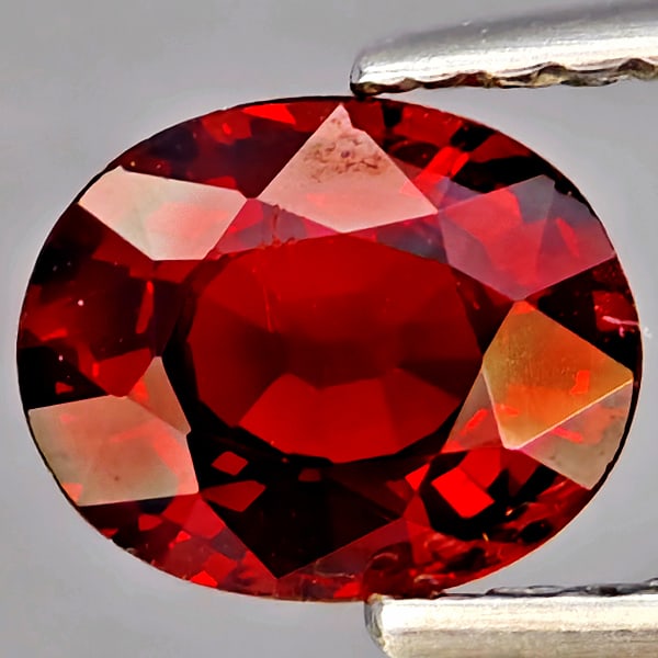 Natural Orangish Red Spessartine Garnet Gemstones 0.91 Ct. Oval Shape 6.5 x 5.2 Mm.: Product ID: 802937339 Product Name: Natural Garnet Weight: 0.91 CT. Size: 6.5 x 5.2 x 3.1 MM. Shape: Oval Shape Color: Orangish Red Clarity:SI1 Luster: Good Gems Origin: Namibia Treatment: Unheated Cr