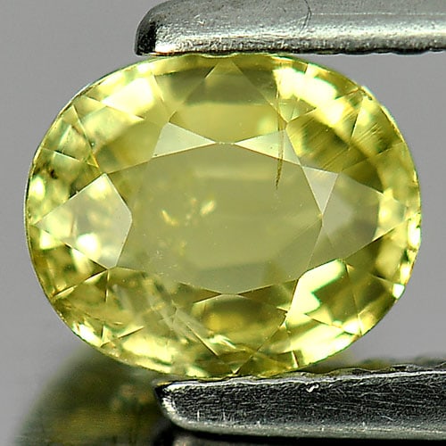Natural Greenish Yellow Chrysoberyl Gemstones 1.02 Ct. Oval Shape 6.3 x 5.3 Mm.: Product ID: 801701081 Product Name: Natural Chrysoberyl Weight: 1.02 CT. Size: 6.3 x 5.3 x 3.3 MM. Shape: Oval Color: Greenish Yellow Clarity:VSI Luster: Good Gems Origin: Madagascar Treatment: Unheat