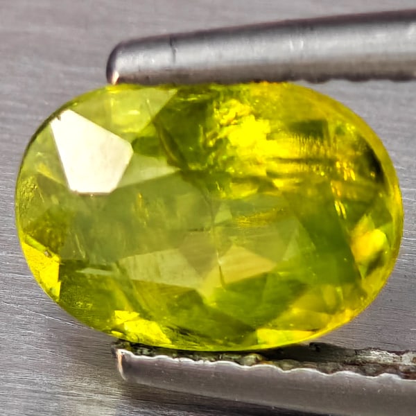 Natural Multi-Color With Rainbow Spark Sphene Gemstones 1.35 Ct. Oval Shape 8.2 x 6.1 Mm.: Product ID: 806509243 Product Name: Natural Sphene Weight: 1.35 CT. Size: 8.2 x 6.1 x 3.5 MM. Shape: Oval Shape Color: Multi-Color Clarity:SI1 Luster: Good Gems Origin: Madagascar Treatment: Unheated 