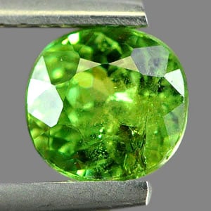 Natural Green Demantoid Garnet Gemstone 1.28 Ct. Oval Shape 6.5 x 6.2 Mm.: Product ID: 802930166 Product Name: Natural Demantoid Weight: 1.28 CT. Size: 6.5 x 6.2 x 3.8 MM. Shape: Oval Color: Green Clarity:SI Luster: Good Gems Origin: Madagascar Treatment: Unheated Crystal St