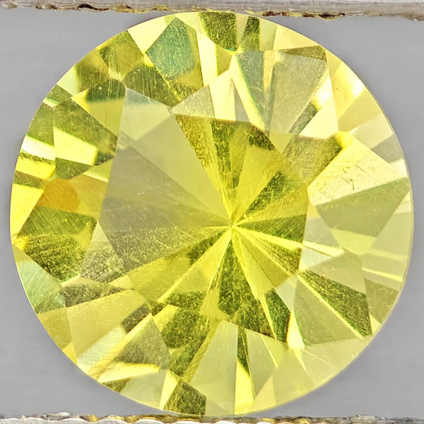 Natural Yellow Lemon Quartz Gemstones 2.34 Ct. Round Diamond Cut 9 Mm.: Product ID: 805530110 Product Name: Natural Quartz Weight: 2.34 CT. Size: 9 x 9 x 6.1 MM. Shape: Round Diamond Cut Color: Yellow Lemon Clarity:VSI Luster: Good Gems Origin: Brazil Treatment: Unheated 