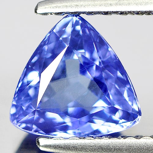 Natural Blue Tanzanite Gemstones 1.15 Ct. Trilliant Shape 6.7 x 6.7 Mm.: Product ID: 807004535 Product Name: Natural Tanzanite Weight: 1.15 CT. Size: 6.7 x 6.7 x 3.9 MM. Shape: Trilliant Color: Blue Clarity:VSI Luster: Good Gems Origin: Tanzania Treatment: Heated Crystal S