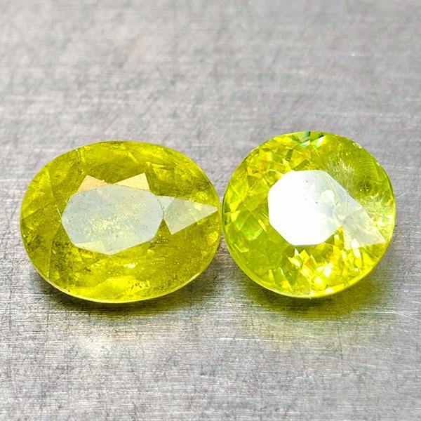 Natural Sphene Gemstones Intense Green Titanium Red Spark 1.13 Ct. 2 Pcs. Mixed Shape 5.5 x 4.5 Mm.: Product ID: 806509008 Product Name: Natural Sphene Weight: 1.13 CT. Size: 5.5 x 4.5 x 2.9 to 4.7 x 4.7 x 3 MM. Shape: Mixed Shape Color: Intense Yellow Green With Red Spark Clarity:SI Luster: Good Gem