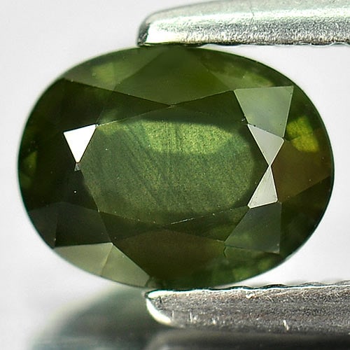 Natural Green Sapphire Gemstones 1.33 Ct. Oval Shape 7.5 x 5.8 Mm.: Product ID: 806154523 Product Name: Natural Green Sapphire Weight: 1.33 CT. Size: 7.5 x 5.8 x 3.5 MM. Shape: Oval Color: Green Clarity:VSI Luster: Good Gems Origin: Thailand Treatment: Heated Crystal 