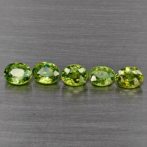 Natural Green Demantiod Garnet Gemstones 1.21 Ct. 5 Pcs Oval Shape 4.3 x 3 Mm.: Product ID: 802937464 Product Name: Natural Demantoid Weight: 1.21 CT. Size: 4.3 x 3 x 2.5 MM. Shape: Oval Shape Color: Green Clarity:SI1 Luster: Good Gems Origin: Madagascar Treatment: Unheated Cryst