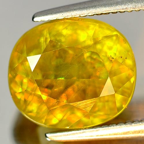 Natural Intense Yellowish Green Titanium Sphene With Rainbow Spark 4.34 Ct.: Product ID: 806506479 Product Name: Natural Sphene Weight: 4.76 CT. Size: 10.1 x 8.8 x 6.8 MM. Shape: Oval Color: Yellowish Green With Rainbow Spark Clarity:SI Luster: Adamantine Gems Origin: Madagasc