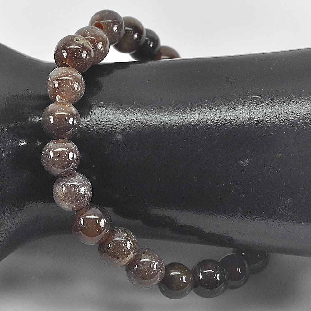 Natural Petrified Wood Brown Unique Pattern 89.44 Ct. Bracelet 8 Inch.: Product ID: 819101988 Product Name: Natural Petrified Wood Weight: 89.44 CT. Size: 8 Inch 8.8 MM. Shape: Round Cabochon Color: Brown Clarity:Opaque Luster: Good Gems Origin: Thailand Treatment: Unheat