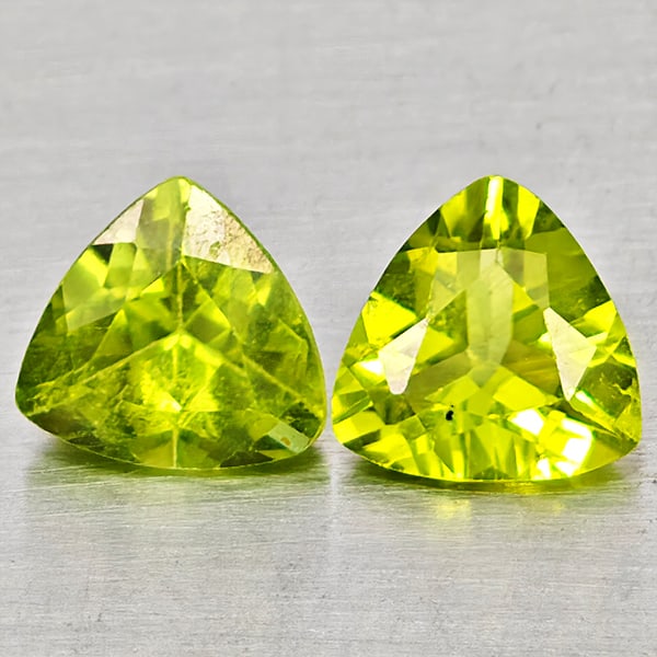 Natural Green Peridot Gemstones 1.35 Ct. 2 Pcs Trilliant Shape 6 Mm.: Product ID: 805317516 Product Name: Natural Peridot Weight: 1.35 CT. Size: 6 x 6 x 3 MM. Shape: Trilliant Color: Green Clarity:VSI Luster: Good Gems Origin: Pakistan Treatment: Unheated Crystal Struct