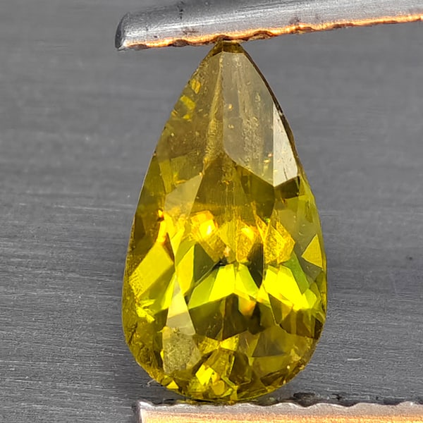 Natural Multi-Color With Rainbow Spark Sphene Gemstones 0.34 Ct. Pear Shape 7.5 x 4.4 Mm.: Product ID: 806509265 Product Name: Natural Sphene Weight: 0.34 CT. Size: 7.5 x 4.4 x 3.6 MM. Shape: Pear Shape Color: Multi-Color Clarity:SI1 Luster: Good Gems Origin: Madagascar Treatment: Unheated 