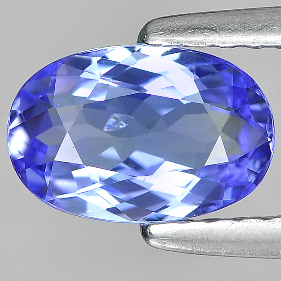 Natural Blue Tanzanite Gemstones 1.04 Ct. Oval Shape 8.06 x 5.33 Mm.: Product ID: 807004350 Product Name: Natural Tanzanite Weight: 1.04 CT. Size: 8.06 x 5.33 x 3.06 MM. Shape: Oval Color: Violet Blue Clarity:VVS Luster: Good Gems Origin: Tanzania Treatment: Heated Crys
