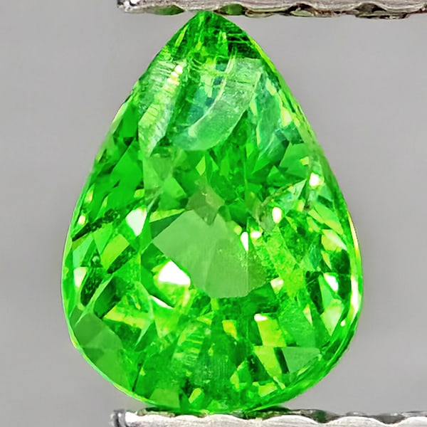 Natural Green Tsavorite Garnet Gemstones 0.52 Ct. Pear Shape 5.2 x 3.9 Mm.: Product ID: 802937039 Product Name: Natural Tsavorite Weight: 0.52 CT. Size: 5.2 x 3.9 x 3.4 MM. Shape: Pear Shape Color: Green Clarity:SI1 Luster: Good Gems Origin: Tanzania Treatment: Unheated Cryst