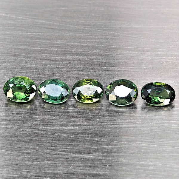 Natural Green Sapphire Gemstones 1.87 Ct. 5 Pcs Oval Shape 5 x 3.8 Mm.: Product ID: 806162997 Product Name: Natural Green Sapphire Weight: 1.87 CT. Size: 5 x 3.8 x 2.9 MM. Shape: Oval Shape Color: Green Clarity:SI1 Luster: Good Gems Origin: Thailand Treatment: Heated Crys