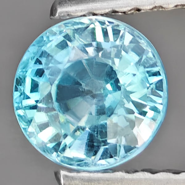 Natural Blue Zircon Gemstones 1.27 Ct. Round Shape 5.9 Mm.: Product ID: 807720082 Product Name: Natural Zircon Weight: 1.27 CT. Size: 5.9 x 5.9 x 3 .9 MM. Shape: Round Color: Blue Clarity:VSI Luster: Good Gems Origin: Cambodia Treatment: Heated Crystal Structu