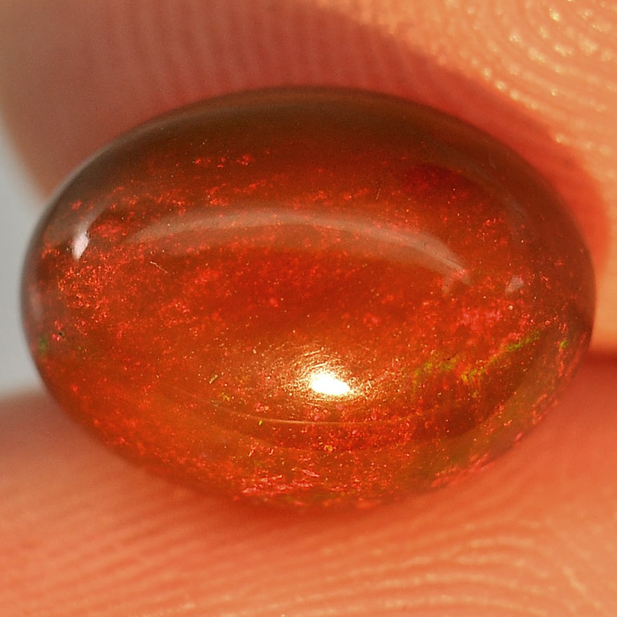 Natural Fire Red Black Opal Gemstones 1.78 Ct. Oval Cabochon Shape 10 x 7.4 Mm.: Product ID: 818725870 Product Name: Natural Opal Weight: 1.78 CT. Size: 10 x 7.4 x 4.8 MM. Shape: Oval Cabochon Color: Multi-Color Clarity:Semi - Transparent Luster: Iridescent Gems Origin: Ethiopia T