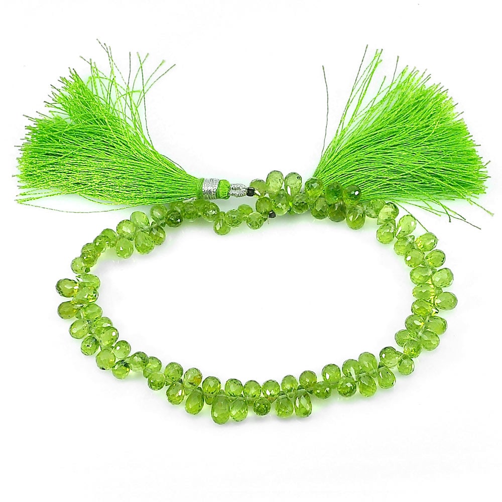 Natural Green Peridot Gemstone Beads 87.85 Ct. Briolette Shape 8.5 Inch: Product ID: 805306813 Product Name: Natural Peridot Weight: 87.85 CT. Size: 8.5 Inch. / 6.8 x 4.6 MM. Shape: Briolette Color: Green Clarity:IF - VVS Luster: Good Gems Origin: Thailand Treatment: Unhea