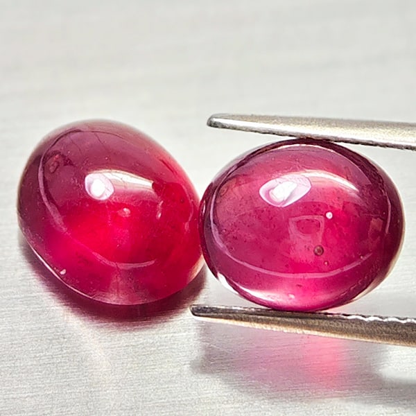 Natural Purplish Red Ruby Gemstones 10.58 Ct. 2 Pcs. Oval Cabochon Shape: Product ID: 805935242 Product Name: Natural Ruby Weight: 10.58 CT. Size: 10.1 x 8 x 6.6 to 9.7 x 8.1 x 5.4 MM. Shape: Oval Cabochon Color: Purplish Red Clarity:Semi - Transparent Luster: Good Gems Ori