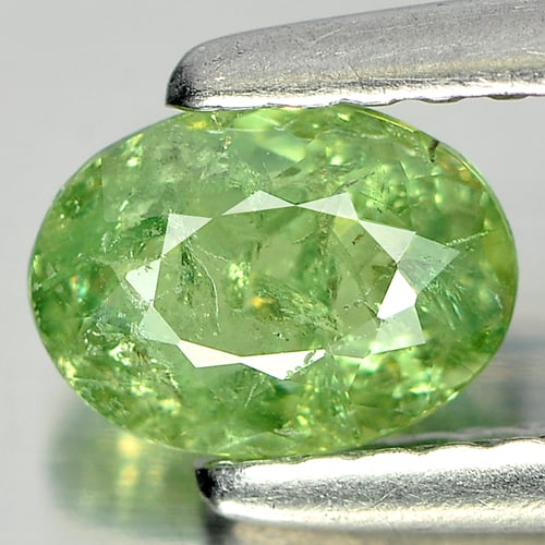 Natural Green Demantoid Garnet Gemstones 0.68 Ct. Oval Shape 6.2 x 4.6 Mm.: Product ID: 802919294 Product Name: Natural Demantoid Weight: 0.68 CT. Size: 6.2 x 4.6 x 2.5 MM. Shape: Oval Color: Green Clarity:SI Luster: Good Gems Origin: Madagascar , Africa Treatment: Unheated C